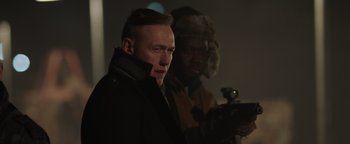 Movie still from “Dangerous” (2021), directed by David Hackl – A man in a black jacket and a man in a brown jacket; Close Up shot, Over the shoulder angle