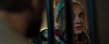 Movie still from “Dangerous” (2021), directed by David Hackl – A person wearing a headdress; Close Up shot, Over the shoulder angle