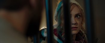 Movie still from “Dangerous” (2021), directed by David Hackl – A woman wearing a knitted hat and a fur trimmed coat; Close Up shot, Over the shoulder angle