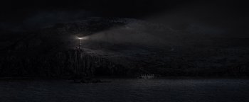 Movie still from “Dangerous” (2021), directed by David Hackl – A light tower on a cliff in the middle of the night; Extreme Wide shot, High angle