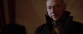 Movie still from “Dangerous” (2021), directed by David Hackl – A person wearing a jacket and a scarf; Close Up shot, Low angle