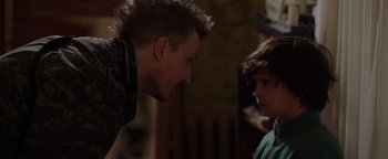 Movie still from “Dangerous” (2021), directed by David Hackl – A man and a boy talking to each other; Close Up shot, Over the shoulder angle