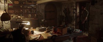 Movie still from “Dangerous” (2021), directed by David Hackl – A room filled with lots of papers on top of a desk; Wide shot, High angle