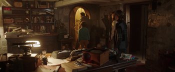 Movie still from “Dangerous” (2021), directed by David Hackl – A group of people standing in a room; Wide shot, Over the shoulder angle