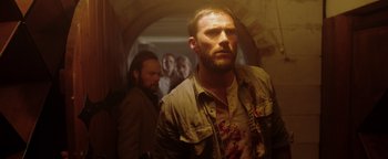 Movie still from “Dangerous” (2021), directed by David Hackl – A man with a bunch of blood all over his face; Medium shot, Low angle