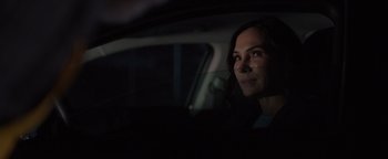 Movie still from “Dangerous” (2021), directed by David Hackl – A woman sitting in the back seat of a car at night; Close Up shot, Over the shoulder angle