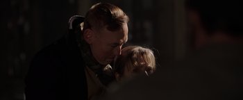 Movie still from “Dangerous” (2021), directed by David Hackl – A man and a little girl looking at each other in the dark; Close Up shot, Over the shoulder angle