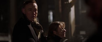 Movie still from “Dangerous” (2021), directed by David Hackl – A man and a woman standing next to each other; Close Up shot, Low angle