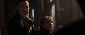 Movie still from “Dangerous” (2021), directed by David Hackl – A man and a woman are standing in the dark; Close Up shot, Low angle