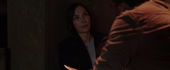 Movie still from “Dangerous” (2021), directed by David Hackl – A woman in a black jacket looking at a man in a brown jacket; Close Up shot, Over the shoulder angle