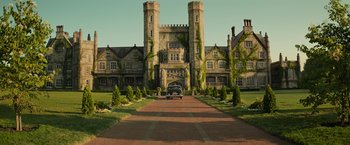 Movie still from “Dark Phoenix” (2019), directed by Simon Kinberg – An old car parked in front of an old building; Extreme Wide shot, Low angle