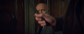 Movie still from “Dark Phoenix” (2019), directed by Simon Kinberg – A bald man holding a cane in his hand; Close Up shot, Over the shoulder angle