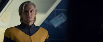 Movie still from “Dark Phoenix” (2019), directed by Simon Kinberg – A man with blonde hair wearing a yellow and black shirt; Close Up shot, Over the shoulder angle