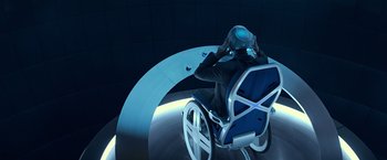 Movie still from “Dark Phoenix” (2019), directed by Simon Kinberg – A man sitting in a chair with a helmet on his head; Wide shot, High angle