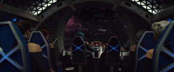 Movie still from “Dark Phoenix” (2019), directed by Simon Kinberg – A view from inside a space ship looking out at the stars; Extreme Wide shot, Over the shoulder angle