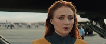Movie still from “Dark Phoenix” (2019), directed by Simon Kinberg – A person with long red hair; Close Up shot, Over the shoulder angle