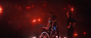 Movie still from “Dark Phoenix” (2019), directed by Simon Kinberg – A man standing next to another man in a chair; Extreme Wide shot, High angle