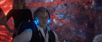 Movie still from “Dark Phoenix” (2019), directed by Simon Kinberg – A man wearing headphones and a white shirt; Close Up shot, High angle