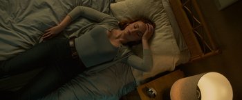 Movie still from “Dark Phoenix” (2019), directed by Simon Kinberg – A woman laying in bed with her head resting on a pillow; Medium shot, High angle