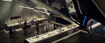 Movie still from “Dark Phoenix” (2019), directed by Simon Kinberg – A man standing in front of a counter in a store; Wide shot, High angle