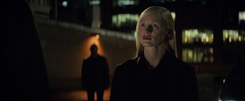 Movie still from “Dark Phoenix” (2019), directed by Simon Kinberg – A woman in a black shirt is standing in the dark; Close Up shot, Low angle