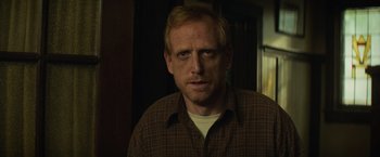 Movie still from “Dark Phoenix” (2019), directed by Simon Kinberg – A person wearing a brown shirt; Close Up shot, Over the shoulder angle