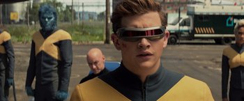 Movie still from “Dark Phoenix” (2019), directed by Simon Kinberg – A young man wearing a yellow and black jacket; Close Up shot, Over the shoulder angle