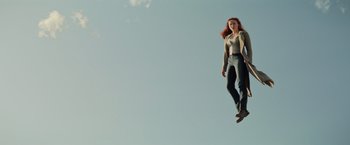 Movie still from “Dark Phoenix” (2019), directed by Simon Kinberg – A woman is flying through the air on a trampoline; Wide shot, Low angle