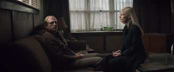 Movie still from “Dark Phoenix” (2019), directed by Simon Kinberg – A man and a woman sitting in a living room talking; Medium shot, Over the shoulder angle