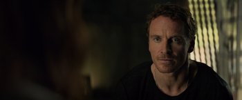 Movie still from “Dark Phoenix” (2019), directed by Simon Kinberg – A person wearing a black t - shirt; Close Up shot, Over the shoulder angle