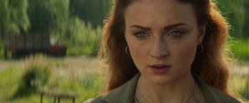 Movie still from “Dark Phoenix” (2019), directed by Simon Kinberg – A woman's face with green eyes; Close Up shot, Over the shoulder angle