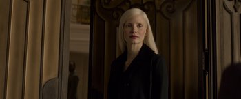 Movie still from “Dark Phoenix” (2019), directed by Simon Kinberg – A woman with white hair standing in front of a wooden door; Close Up shot, Low angle