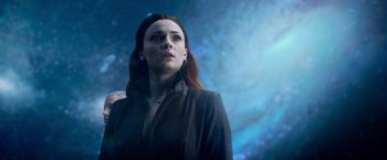 Movie still from “Dark Phoenix” (2019), directed by Simon Kinberg – A woman in a black jacket looking up at the sky; Close Up shot, Low angle