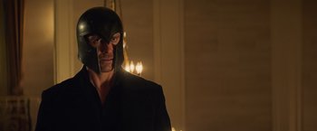 Movie still from “Dark Phoenix” (2019), directed by Simon Kinberg – A man wearing a black mask and a black jacket; Close Up shot, Over the shoulder angle