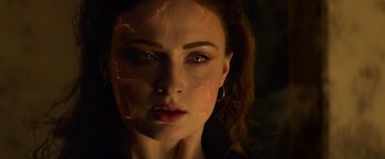 Movie still from “Dark Phoenix” (2019), directed by Simon Kinberg – A person's face in a dark room; Close Up shot, Over the shoulder angle