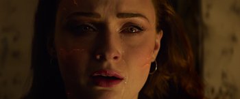 Movie still from “Dark Phoenix” (2019), directed by Simon Kinberg – A woman's face with tears coming out of her eyes; Close Up shot, Overhead angle