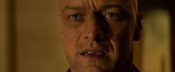 Movie still from “Dark Phoenix” (2019), directed by Simon Kinberg – A man's face with green eyes; Close Up shot, Low angle