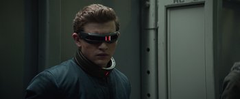 Movie still from “Dark Phoenix” (2019), directed by Simon Kinberg – A man wearing a pair of futuristic glasses; Close Up shot, Low angle