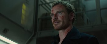 Movie still from “Dark Phoenix” (2019), directed by Simon Kinberg – A person wearing a black shirt with blood all over his face; Close Up shot, Low angle