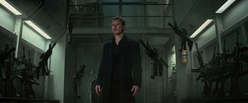 Movie still from “Dark Phoenix” (2019), directed by Simon Kinberg – A man in a black coat standing in a room; Medium shot, Low angle