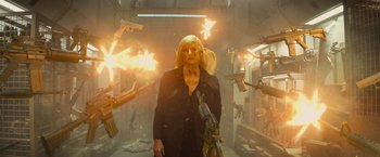 Movie still from “Dark Phoenix” (2019), directed by Simon Kinberg – An image of a woman holding a gun in the middle of a room; Medium shot, Low angle