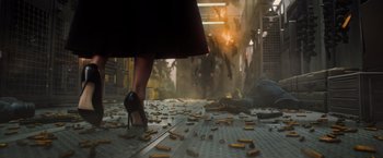 Movie still from “Dark Phoenix” (2019), directed by Simon Kinberg – A woman in high heel shoes walking down a street; Wide shot, Low angle