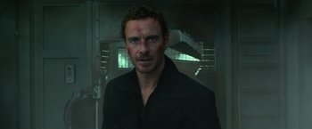Movie still from “Dark Phoenix” (2019), directed by Simon Kinberg – Michael fassbender in a black jacket; Close Up shot, Low angle