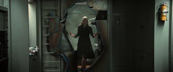 Movie still from “Dark Phoenix” (2019), directed by Simon Kinberg – A woman standing in front of a broken wall; Medium shot, Low angle