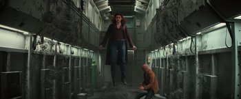 Movie still from “Dark Phoenix” (2019), directed by Simon Kinberg – A man kneeling down next to a woman in an elevator; Wide shot, Low angle