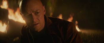Movie still from “Dark Phoenix” (2019), directed by Simon Kinberg – A man with a bald head and a cigarette in his mouth; Close Up shot, Over the shoulder angle