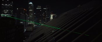 Movie still from “To Catch a Killer” (2023), directed by Damián Szifron – A view of a city at night from a building; Extreme Wide shot, High angle