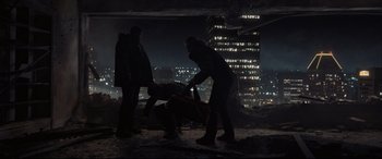 Movie still from “To Catch a Killer” (2023), directed by Damián Szifron – A group of people standing on top of a building; Extreme Wide shot, High angle