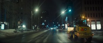 Movie still from “To Catch a Killer” (2023), directed by Damián Szifron – A city street at night lit up by street lights; Extreme Wide shot, Low angle