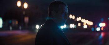 Movie still from “To Catch a Killer” (2023), directed by Damián Szifron – A person wearing a jacket; Close Up shot, Low angle